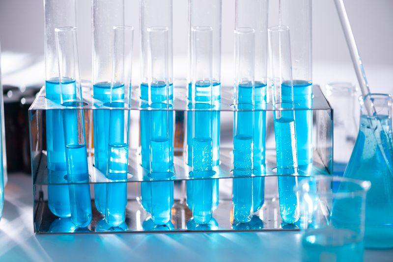Researchers working at optical bench with fibre cables