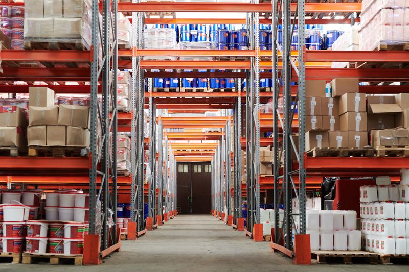 Automated container yard with cranes and stacked shipping boxes